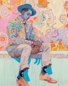 Man in Patterned Suit Sitting