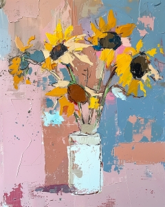 Girasoles en un tarro blanco
